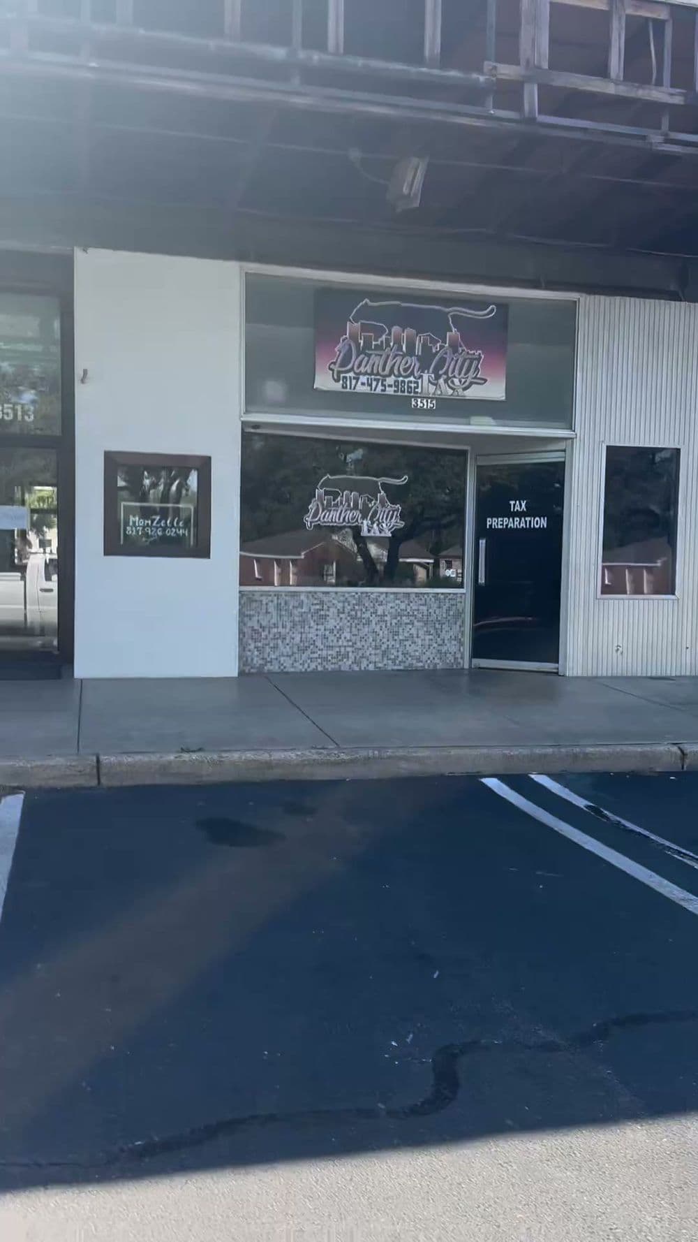 Exterior of Dandy Tax Service building with signage and parking area visible.