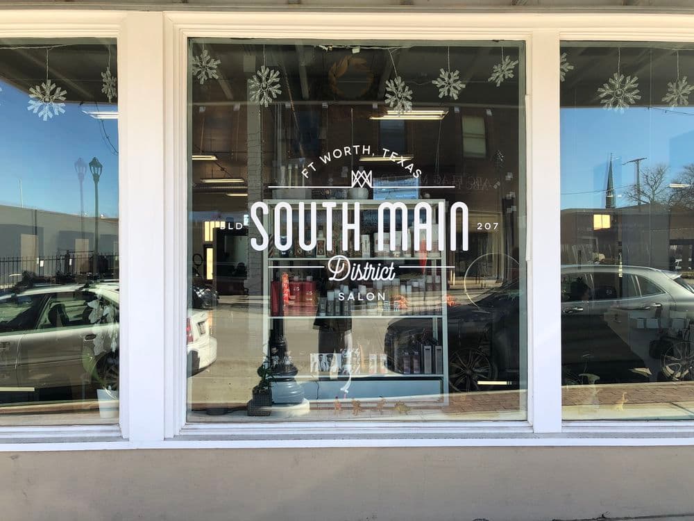 South Main District Salon storefront in Fort Worth, Texas with decorative snowflakes.