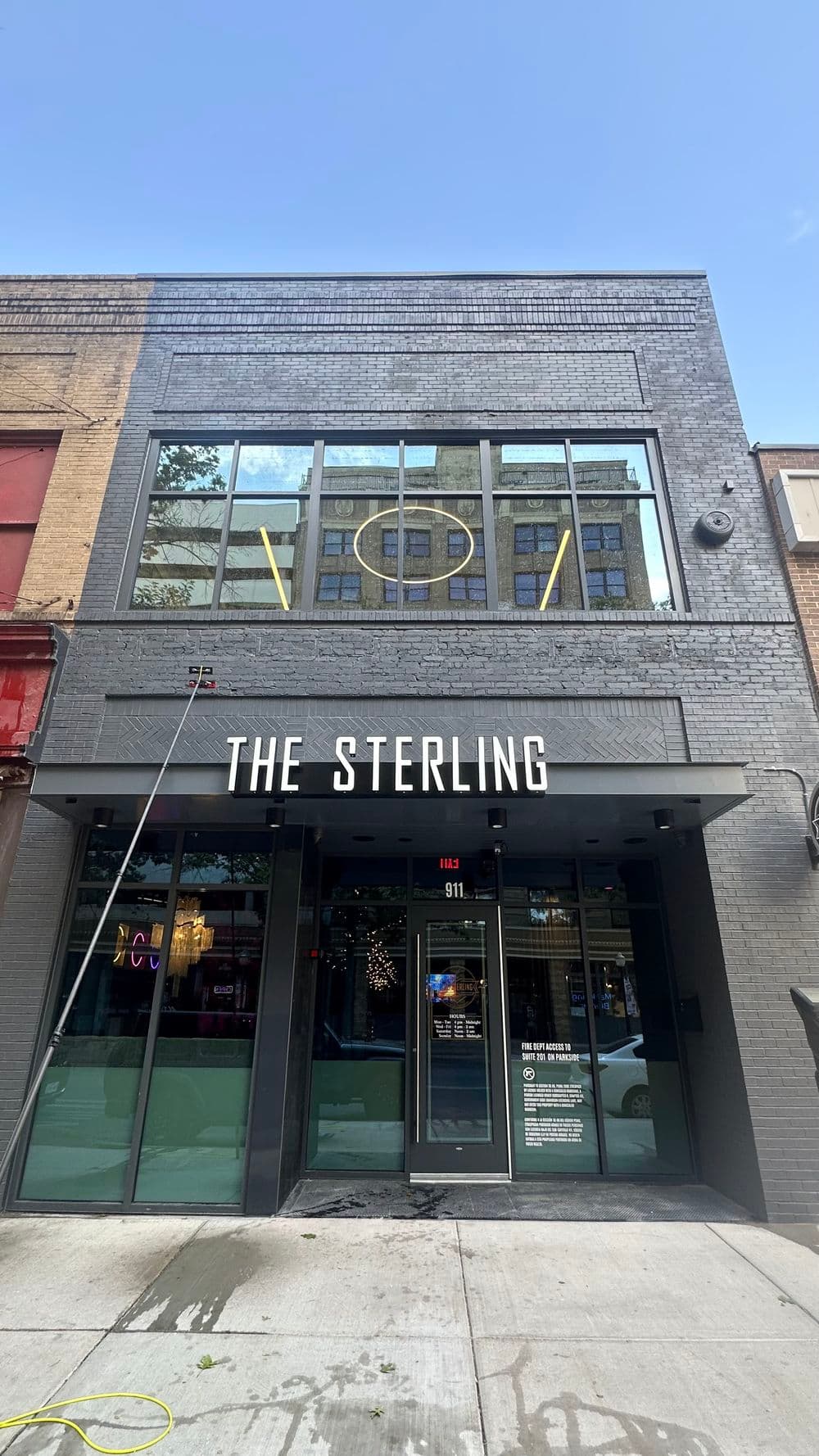 The Sterling building exterior with large windows and modern design in urban setting.