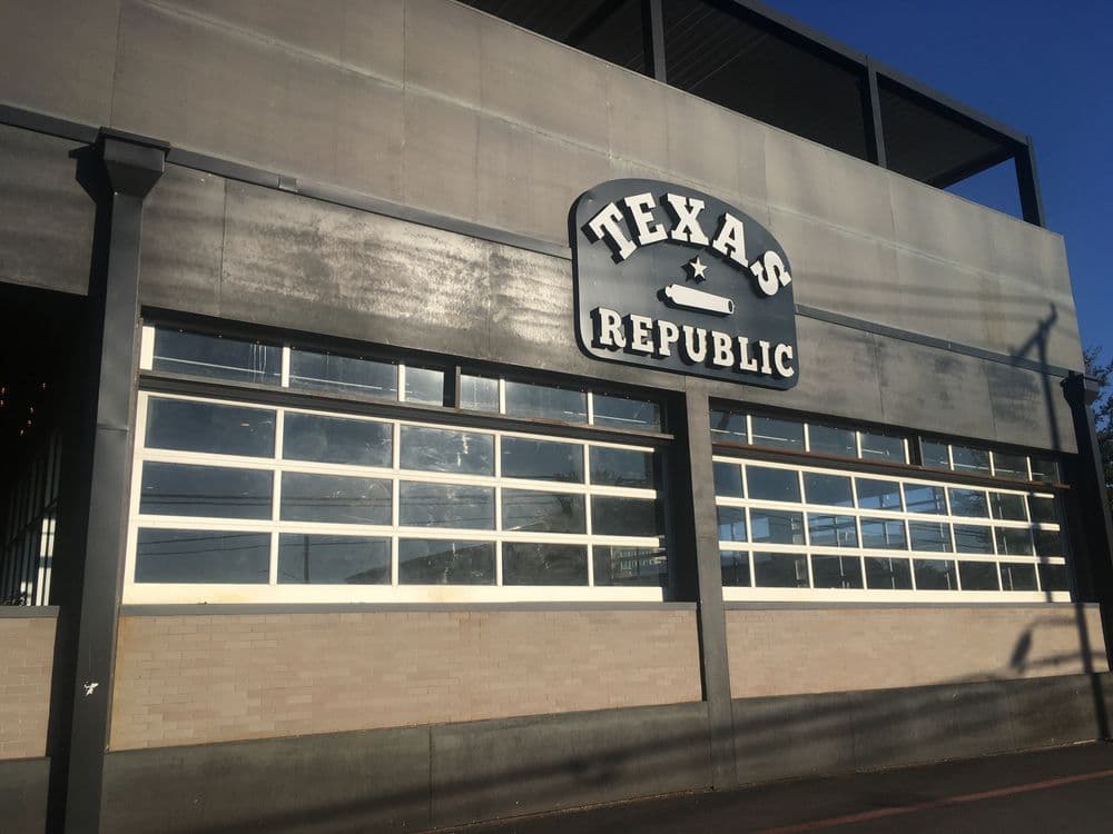 Texas Republic restaurant exterior with prominent sign against a clear blue sky.