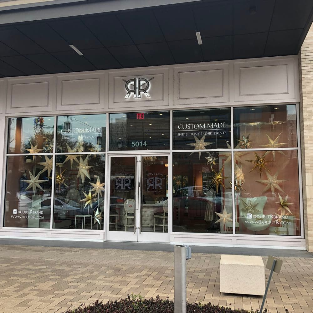 Custom made shirts and ties storefront, featuring decorative star displays, located at 5014.