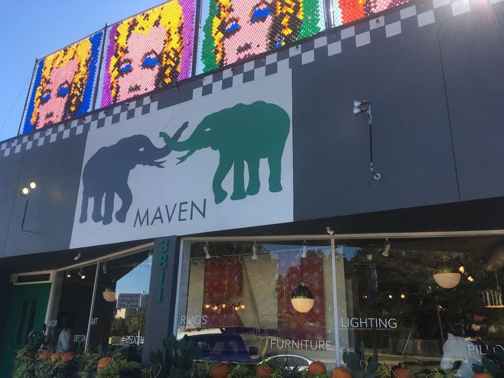 Colorful storefront of Maven featuring a large elephant mural with vibrant artwork above.
