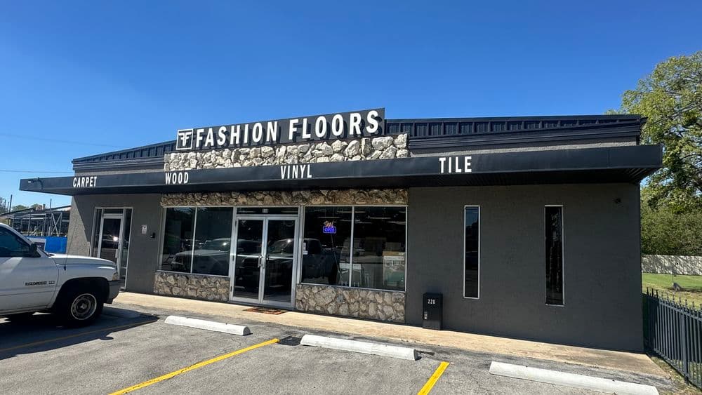 Fashion Floors storefront showcasing carpet, wood, vinyl, and tile flooring options.