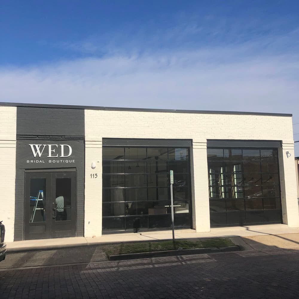 Exterior of WED Bridal Boutique, showcasing modern architecture and large windows.