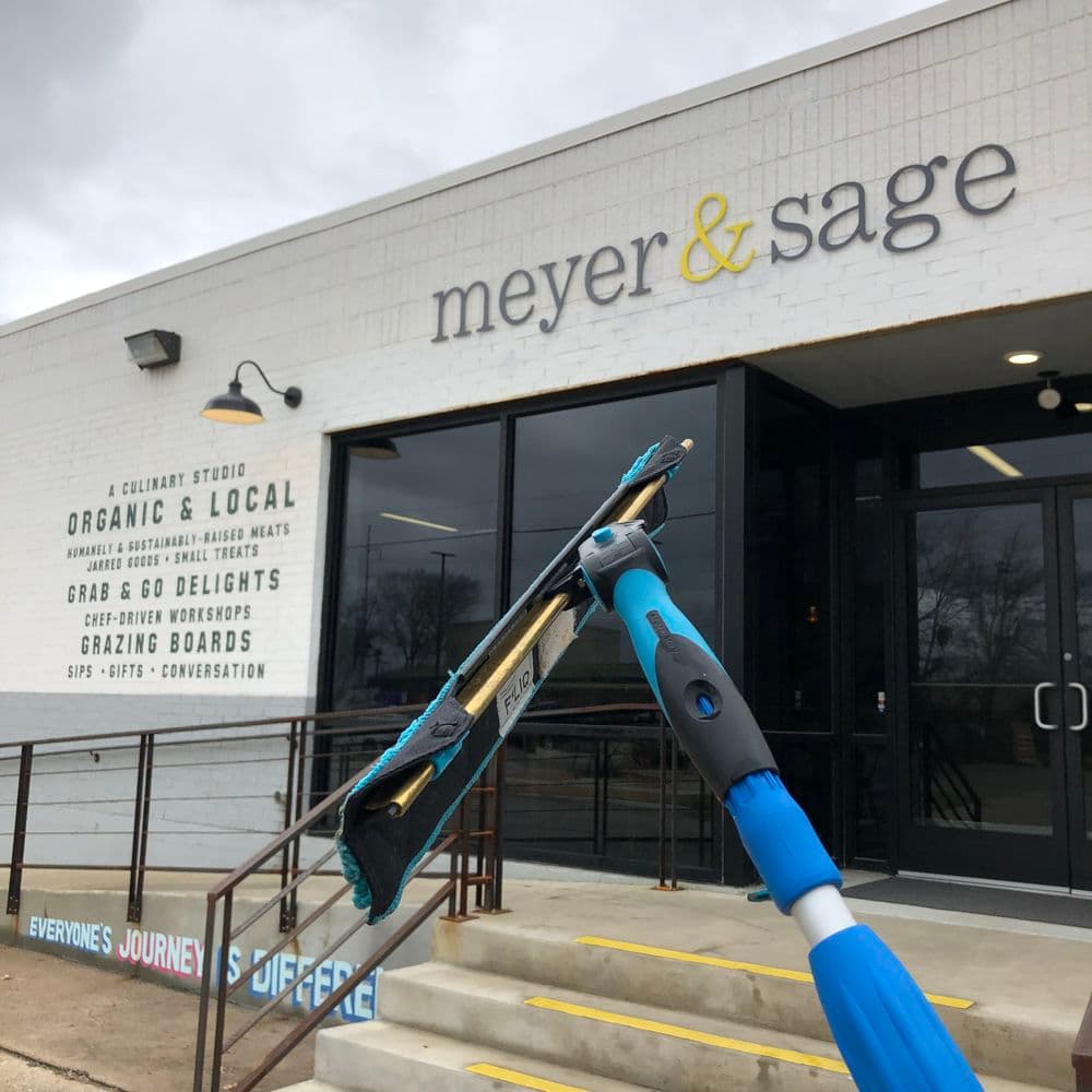 Exterior of Meyer & Sage culinary studio featuring an entrance and promotional signage.